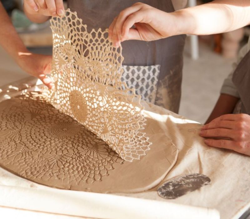 clay being embossed with lace